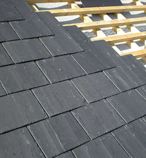 Part way through a slate roof in Stoke